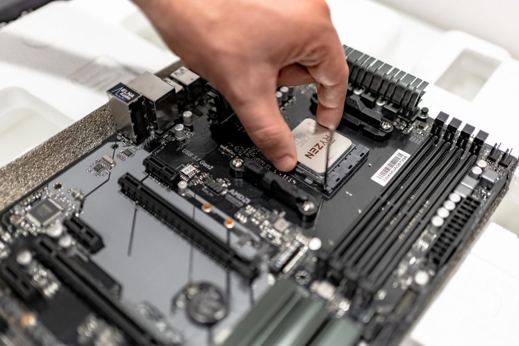 A Person Touching the Laptop Hardware